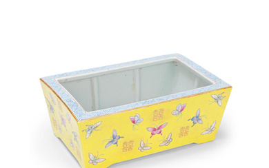 A FAMILLE ROSE YELLOW-GROUND 'BUTTERFLIES' JARDINIERE Guangxu six-character mark and...