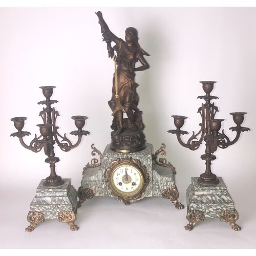 A FRENCH THREE PIECE GILT METAL FIGURAL CLOCK GARNITURE With...