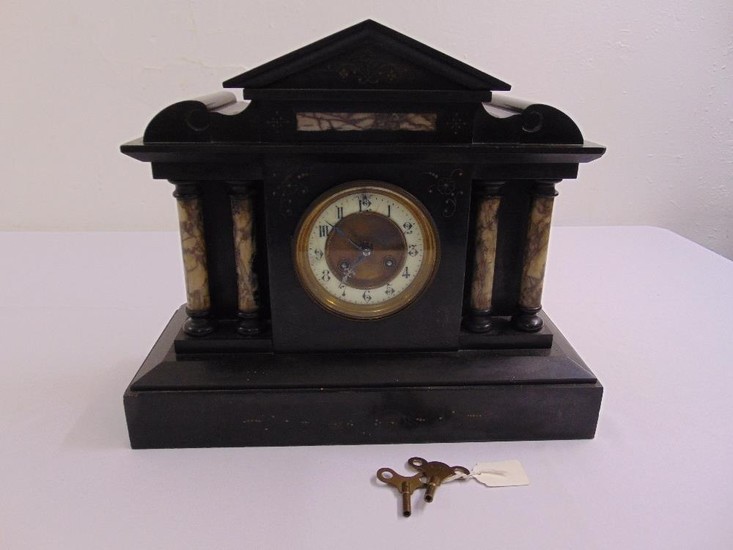 A French black marble mantle clock of architectural form to ...