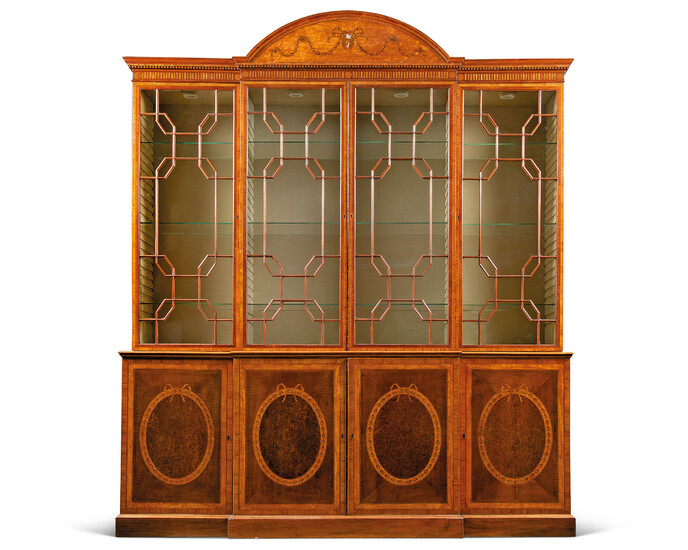 A GEORGE III SATINWOOD, HAREWOOD, BURR-YEW, TULIPWOOD AND MARQUETRY BREAKFRONT BOOKCASE
