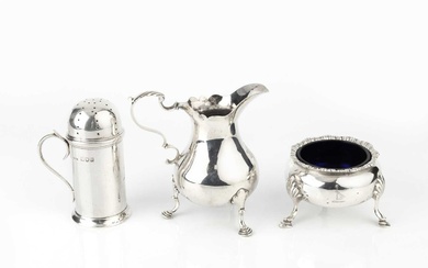 A George III silver cream jug, with scroll handle and...
