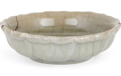 A Korean stoneware celadon foliate small dish, Goryeo dynasty, 12th century, on short tapering foot with rounded sides rising to a moulded foliate rim, covered in an allover celadon glaze suffused with crackles, with kintsugi repair to the rim, 8cm...