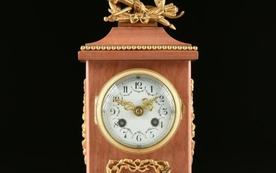 A LOUIS XVI STYLE GILT BRONZE MOUNTED PINK MARBLE