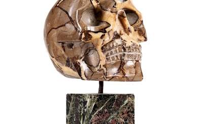 A MADAGASCAN CARVED SEPTARIAN NODULE SKULL 20TH CENTURY