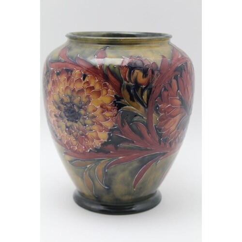 A MOORCROFT POTTERY VASE, tube lined and painted Spanish flo...