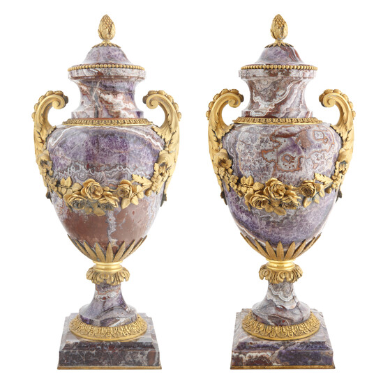 A PAIR OF ROUGE GRIOTTE MARBLE AND ORMOLU URNS