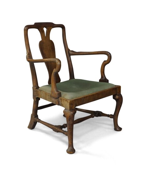 A Queen Anne walnut open arm elbow chair, c.1710, with vase shaped central splat and shepherdâ€™s crook arms, on cabriole legs united by an â€˜Hâ€™ stretcher Provenance: The Geoffrey and Fay Elliot collection.