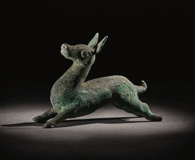 A RARE BRONZE FIGURE OF A DOE WARRING STATES PERIOD - HAN DYNASTY