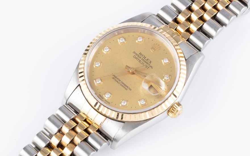 A ROLEX OYSTER PERPETUAL DATE JUST AUTOMATIC WRISTWATCH; ref. 16233 in 18ct gold and stainless steel, s/no. W507048 with sunburst go...