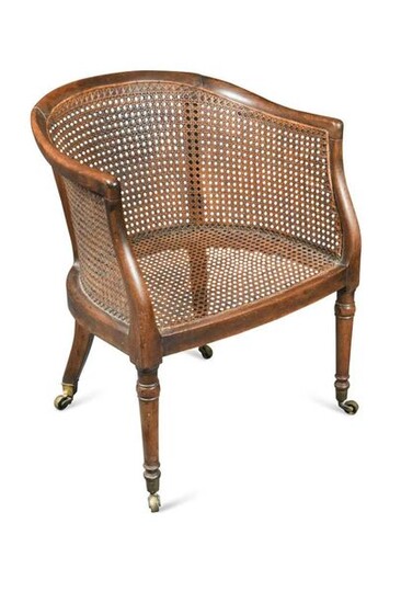 A Regency mahogany caned library bergere tub chair…