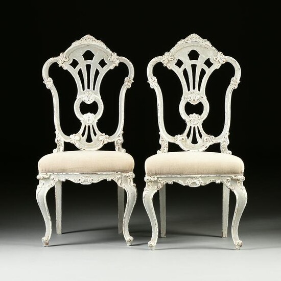 A SET OF EIGHT ITALIAN ROCOCO STYLE PAINTED AND CARVED