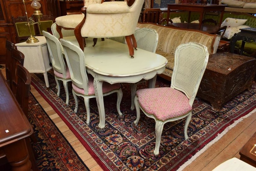 A SEVEN PIECE SETTING INCLUDING FRENCH STYLE EXTENSION DINING TABLE AND MATCHING SET OF SIX SHABBY CHIC CHAIRS WITH RATTAN BACK AND...