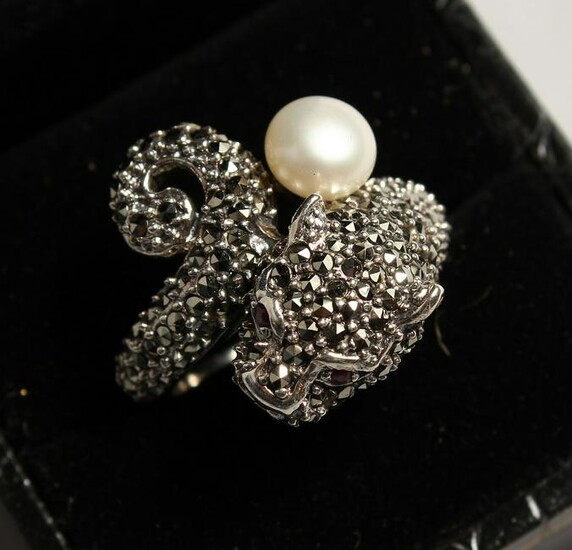A SILVER AND MARCASITE PANTHER AND PEARL RING