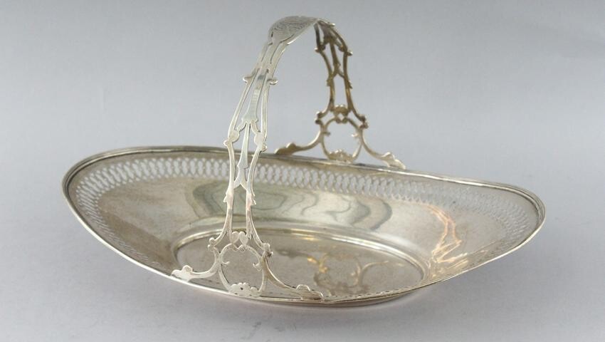 A STERLING SILVER PIERCED OVAL CAKE BASKET with handle.