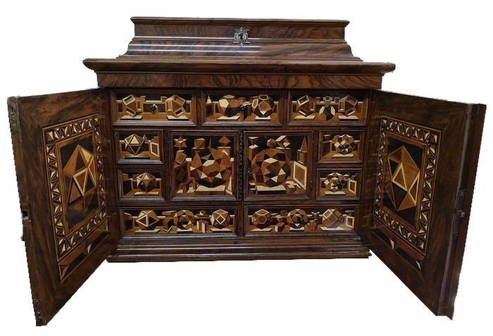 A South German ‘Kunstkammer’ Cabinet, probably Nuremberg - the interior with polyhedral marquetry - Ash, Ebony, Ivory, Oak, Walnut, various other woods, including Fruitwood - escutcheons, hinges and handles probably in Silver - Marquetry: second half...