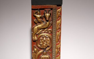 A TIBETAN CARVED AND PAINTED GILT WOOD PANEL FROM A THRONE BACK