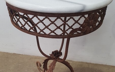 A WROUGHT IRON BASED MARBLE TOP SIDE TABLE