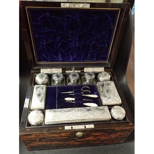 A beautiful wooden traveling box, containing silver mounted ...
