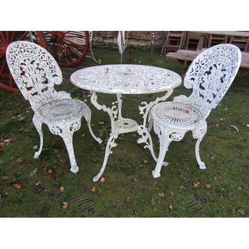 A cast aluminium garden terrace table of circular form with ...