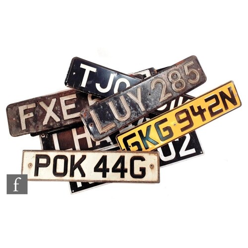 A collection of early and later vehicle license plates to in...