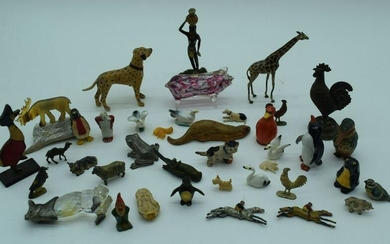 A collection of small metal, glass and horn animals