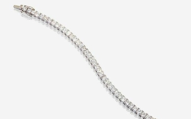 A diamond and fourteen karat white gold line bracelet