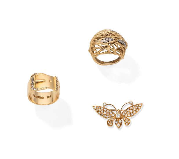 A diamond buckle ring, 1915, a diamond bombé ring, circa 1960, and a diamond butterfly brooch
