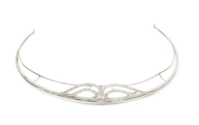A diamond set tiara, of shaped and curved openwork design,...