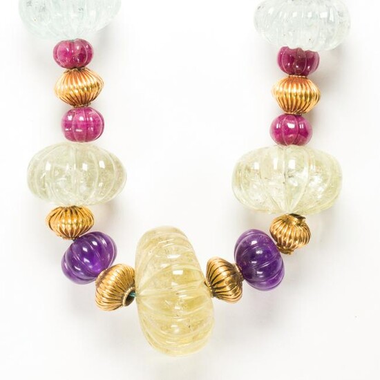 A gemstone and eighteen karat gold necklace