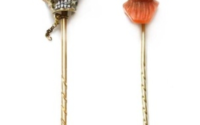 A gold enamel stick pin