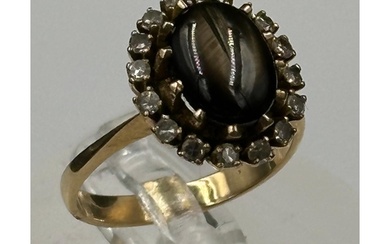 A gold tigers eye ring with diamonds AF Size M