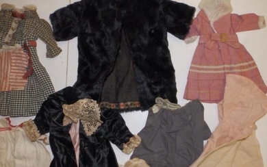 A large quanity of dolls' clothing including hats and...