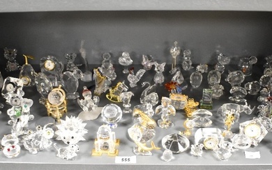 A large quantity of Swarovski crystal ornaments, various to include state carriage, globe clock