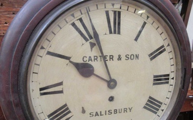 A late Victorian mahogany station clock by Carter and Son...