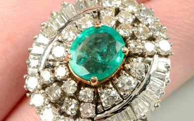 A mid 20th century 14ct gold emerald and vari-cut diamond cluster ring.Emerald calculated weight