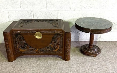 A modern Chinese chest with carved panels; together with a similar occasional table (2)