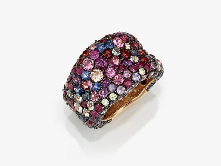 A modern band ring studded with sapphires, tourmalines