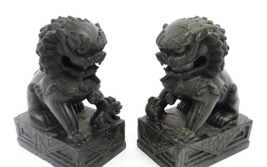 A pair of Chinese carved hardstone foo dogs / guardian lions...