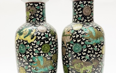 A pair of Chinese hand enamelled famille noir porcelain vases H. 40cm. Six character mark to base for Kangxi (1662-1722) probably later