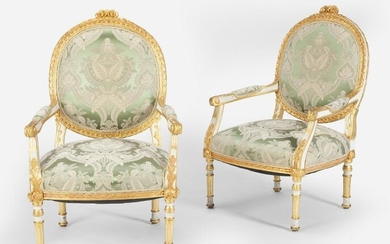 A pair of Louis XVI-style carved giltwood fauteuils