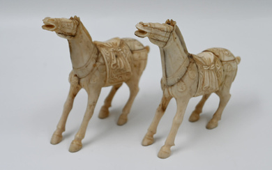 A pair of antique I-V-OR-Y horse sculptures, hand-carved wooden...