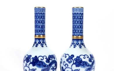 A pair of blue and white gallbladder vases painted with gold