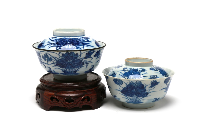 A pair of blue and white porcelain covered bowls painted with mandarin ducks among lotus flowers