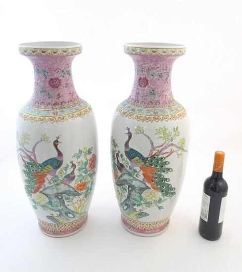 A pair of large Chinese vases decorated with peacock