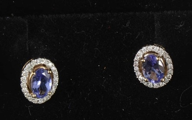 A pair of tanzanite and diamond earstuds.