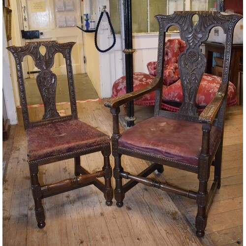 A set of eight 18th century style oak dining chairs, carved ...