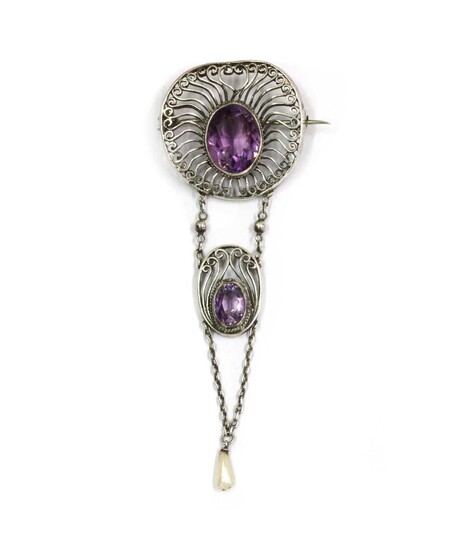 A silver Arts and Crafts amethyst and dog tooth pearl brooch, c.1910
