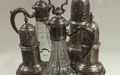 A silver Warwick cruet set complete with original casters and bottles.