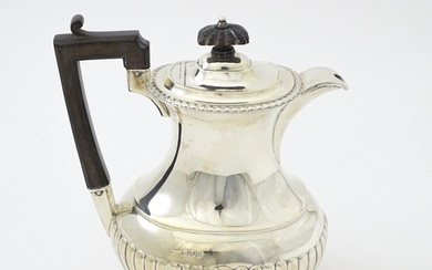 A silver hot water pot hallmarked London 1910, maker Arnold ...