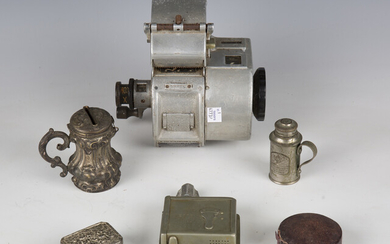 A small group of collectors' items, including a bus ticket machine and punch, a surgeon's